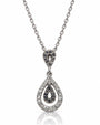 9ct white gold pear drop pendant with white and black pavé diamonds on trace chain