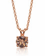 Round morganite solitaire pendant in 9ct rose gold with four ball-tipped claws on twisted curb chain