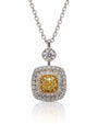 Cushion-shaped yellow and white gold diamond halo pendant on a white gold cable chain