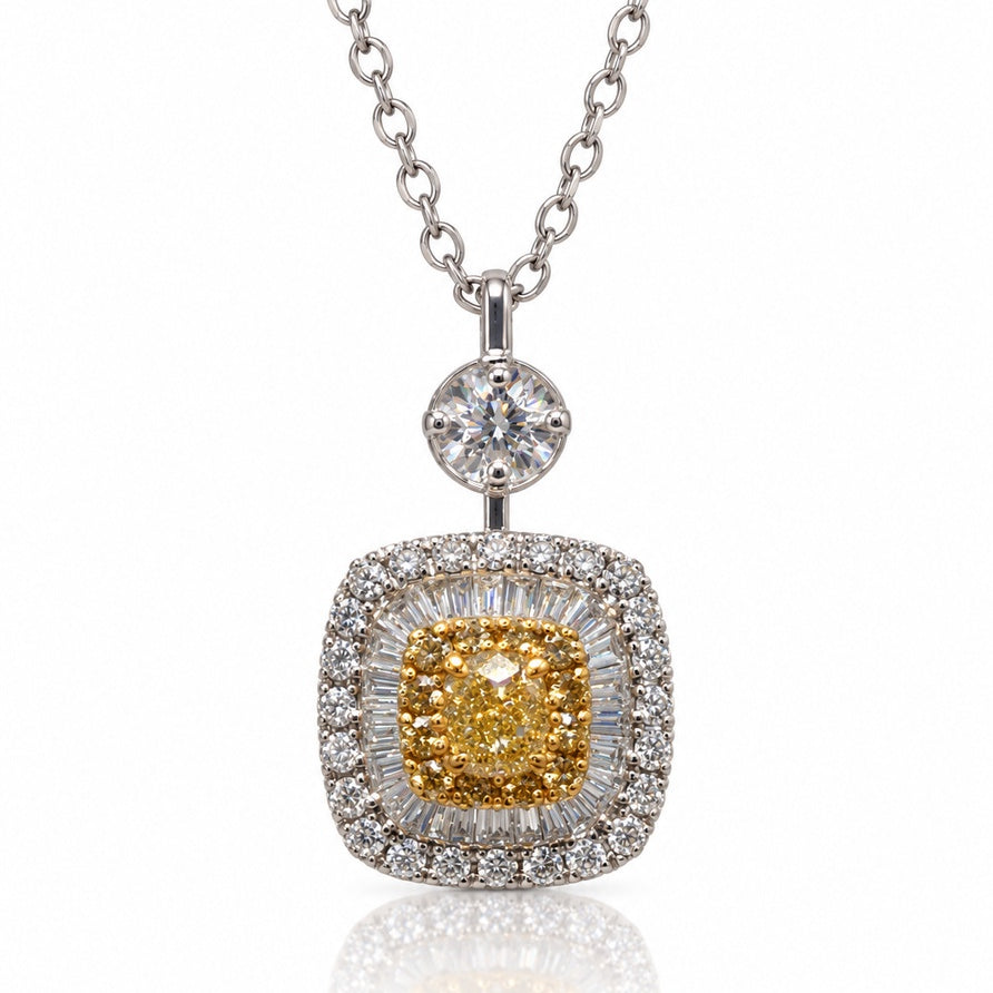 Cushion-shaped yellow and white gold diamond halo pendant on a white gold cable chain