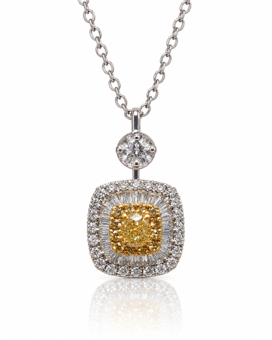Cushion-shaped yellow and white gold diamond halo pendant on a white gold cable chain