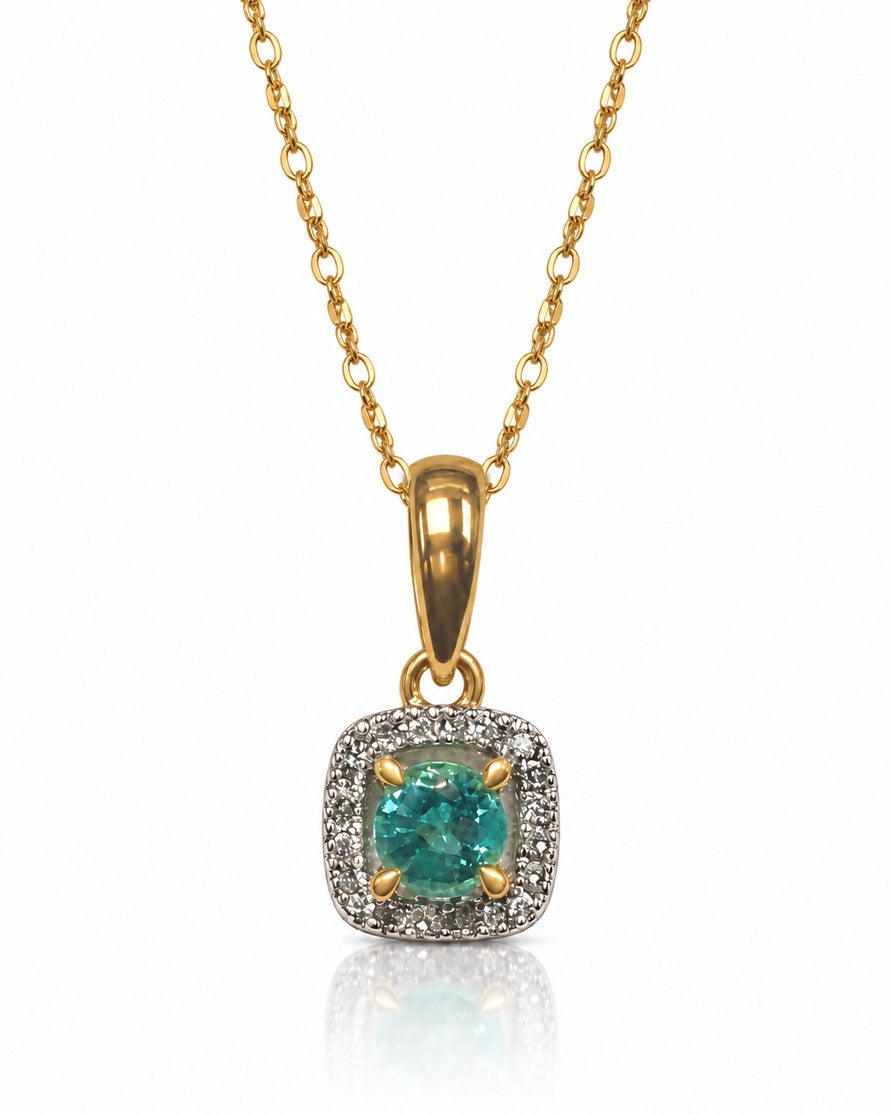 Round emerald in cushion-shaped diamond halo pendant on fine cable chain, 9ct yellow gold
