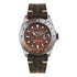 Out Of Order Swiss GMT Havana quartz watch with brown full-lume dial, rotating GMT bezel, and distressed leather strap on white background