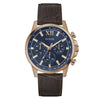 Guess Walker GW0901G3 quartz chronograph watch with 44mm rose gold-tone case, blue dial with Roman numerals, and brown embossed leather strap