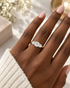 Slim polished court-profile yellow gold band of the trilogy engagement ring