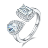 Sterling silver open bypass ring with emerald cut and pear cut moissanite stones in halo settings