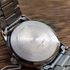 Side view of 37 mm round stainless steel case showing thickness