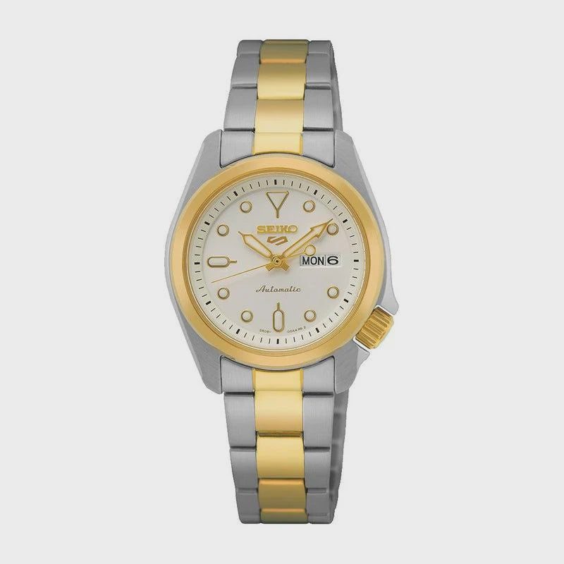Seiko 5 Sports SRE004K1 automatic ladies watch with white dial, two-tone stainless steel bracelet, gold-tone bezel, and day-date display at 3 o'clock