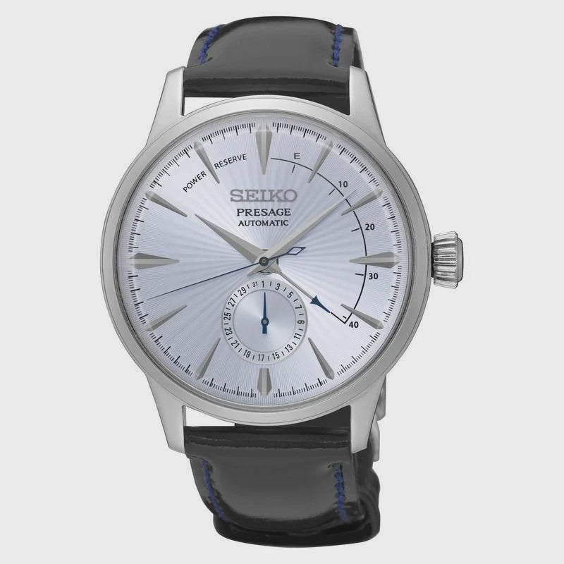 Seiko Presage SSA343J1 automatic watch with silvery-blue radial dial, power reserve indicator, small seconds, stainless steel case, and black leather strap with blue stitching