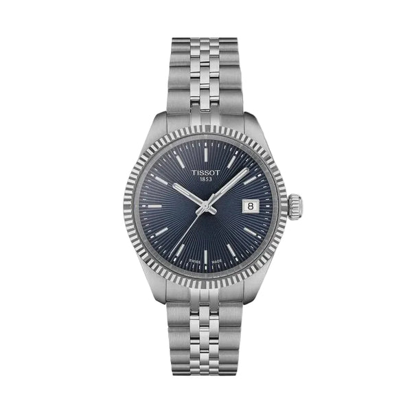 Tissot Ballade Swiss Quartz watch with sunburst blue dial, fluted stainless steel bezel, and three-link stainless steel bracelet on white background