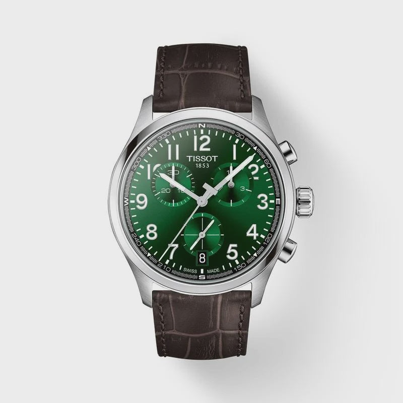 Tissot Chrono XL quartz chronograph watch with emerald green dial, 42mm stainless steel case, brown embossed leather strap, and sapphire crystal