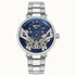 Ingersoll Tennessee I13104 automatic watch with blue skeleton dial showing twin balance wheels and stainless steel bracelet