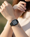 Cassims&Co. Casio ana-digi watch with grey dial and black resin strap worn on a woman's wrist