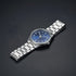 Cassims&Co. Casio quartz watch with a blue sunburst dial, white Arabic numerals, and a stainless steel bracelet.