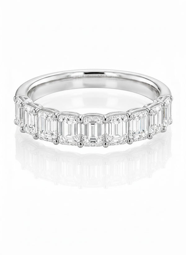 Cassims&Co. 9ct white gold eternity ring featuring nine emerald-cut lab grown diamonds in a prong setting.
