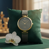 Cassims&Co. Obaku Diamant watch with a grey sunray dial, diamond accent, and gold-tone bezel on a mesh bracelet.