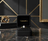 Cassims&Co. 9ct yellow gold engagement ring featuring a 0.50ct oval lab grown diamond in a black velvet ring box.