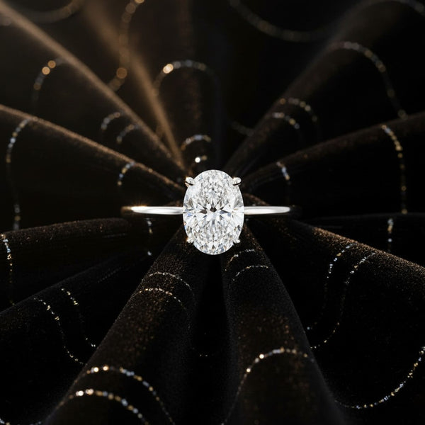 Cassims&Co. 9ct white gold engagement ring with a 1.5ct oval lab grown diamond in a classic four-claw solitaire setting