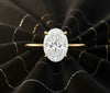 Cassims&Co. 9ct yellow gold engagement ring featuring a 2.00ct oval lab grown diamond in a four-prong solitaire setting.