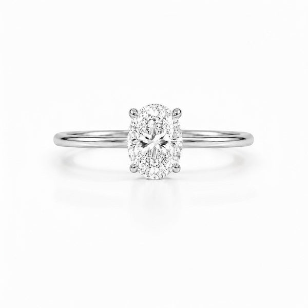 Cassims&Co. 9ct white gold engagement ring with a 1.5ct oval lab grown diamond in a classic four-claw solitaire setting.