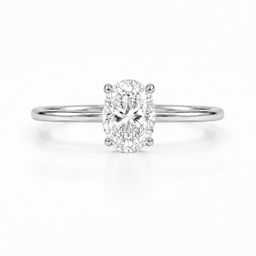 Cassims&Co. 9ct white gold engagement ring with a 1.5ct oval lab grown diamond in a classic four-claw solitaire setting.