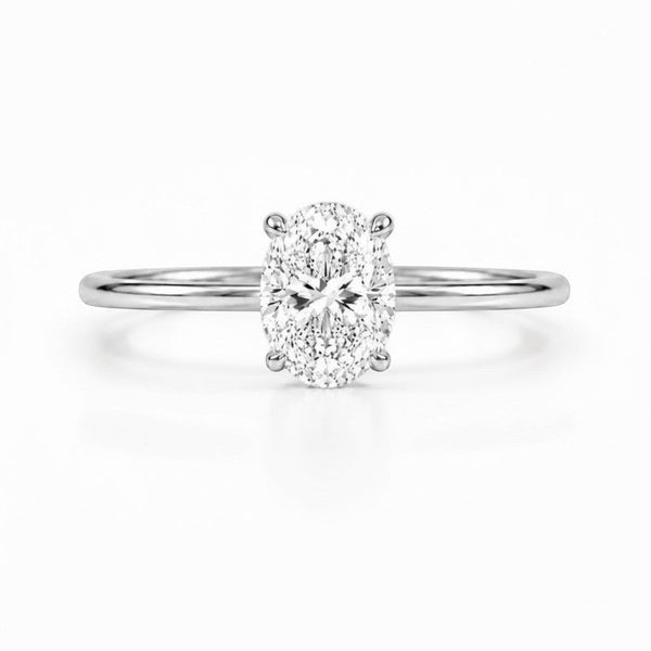 Cassims&Co. 9ct white gold engagement ring with a 1.5ct oval lab grown diamond in a classic four-claw solitaire setting.