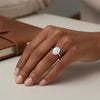 Cassims&Co. 9ct white gold engagement ring featuring a 1.5ct oval lab grown diamond on a model's hand.