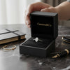Cassims&Co. 9ct white gold engagement ring featuring a 0.50ct pear-shaped lab grown diamond in a black gift box.