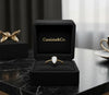 Cassims&Co. 9ct yellow gold engagement ring with a 0.50ct pear-shaped lab grown diamond in a black velvet box.