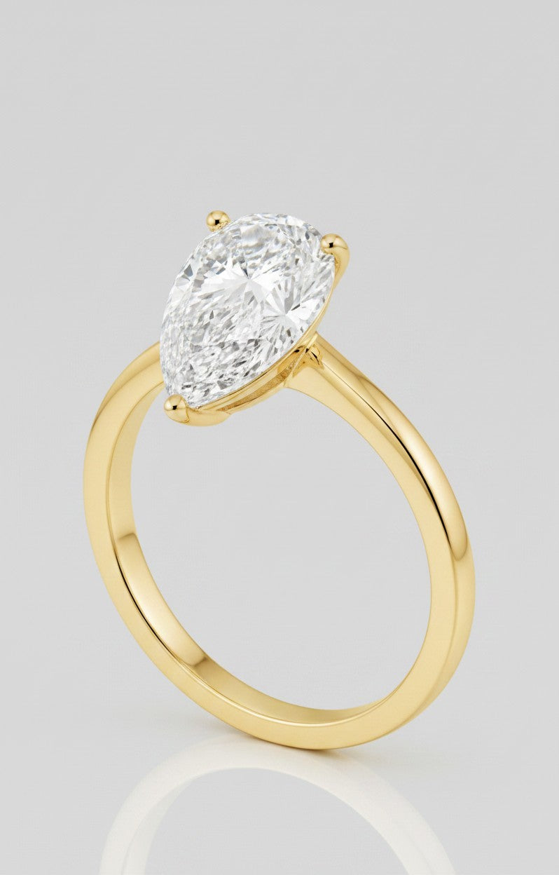Cassims&Co. 2.00ct pear shape lab grown diamond solitaire engagement ring in 9ct yellow gold with a prong setting.