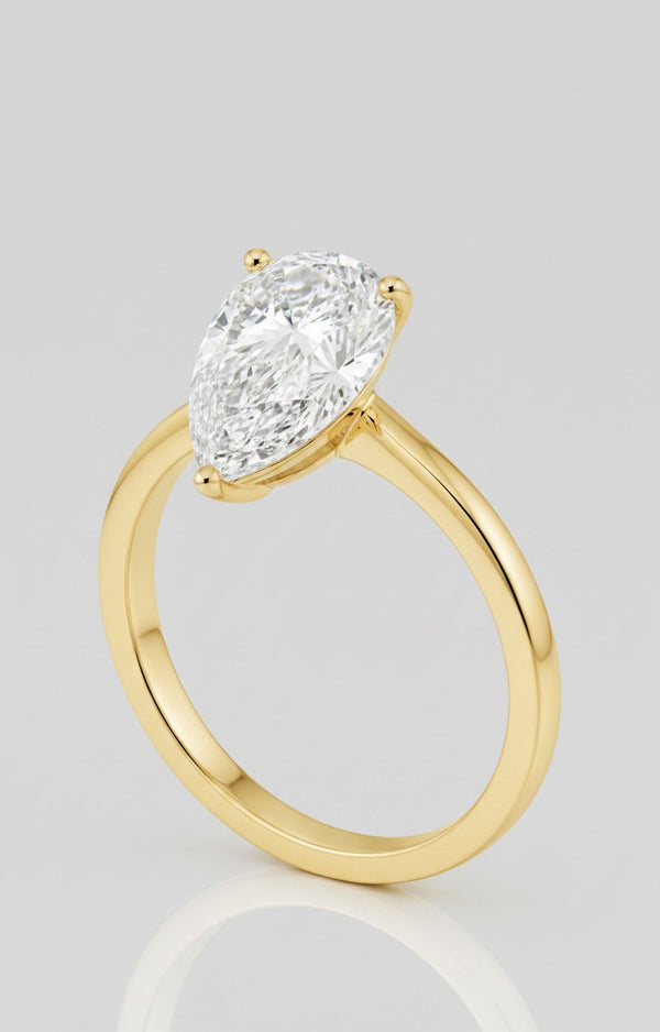 Cassims&Co. 2.00ct pear shape lab grown diamond solitaire engagement ring in 9ct yellow gold with a prong setting.