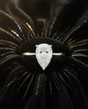 Cassims&Co. 9ct white gold engagement ring featuring a 1.58ct pear-shaped lab grown diamond solitaire on black velvet.