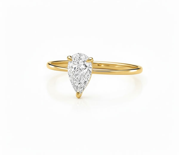 Cassims&Co. 9ct yellow gold solitaire engagement ring with a 0.50ct pear-cut lab grown diamond in a four-claw setting.