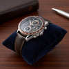 Cassims&Co. pre-owned TAG Heuer Carrera chronograph watch with a brown dial, stainless steel case, and leather strap.