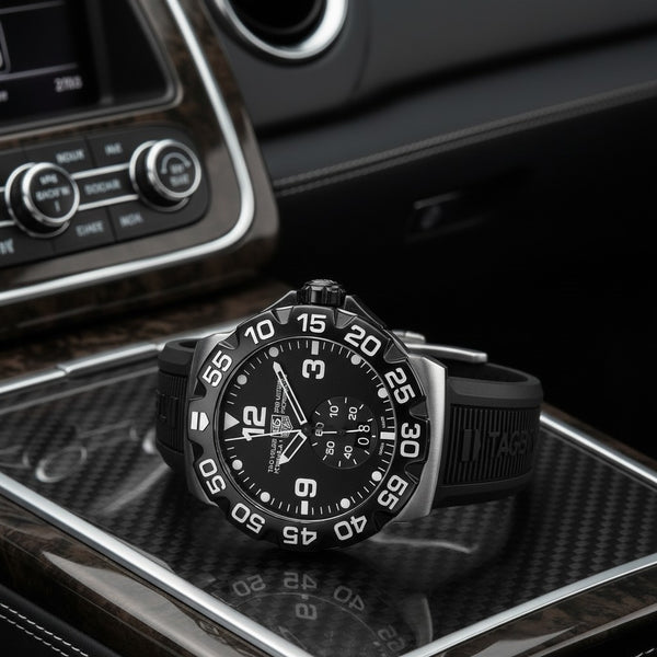 Cassims&Co. pre-owned TAG Heuer Formula 1 Grande Date watch with black dial and rubber strap on a car console