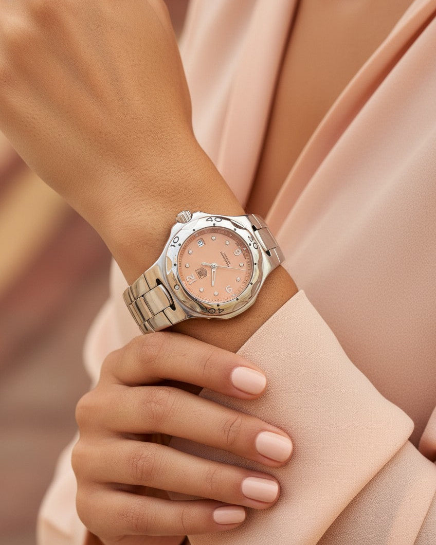 Cassims&Co. pre-owned TAG Heuer Professional ladies watch with a salmon dial, diamond markers, and stainless steel band