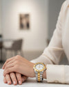 Cassims&Co. pre-owned TAG Heuer Professional 2000 two-tone ladies' diver watch with silver dial on a wrist