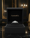 Cassims&Co. 1.8ct lab grown diamond three stone ring in 9ct white gold displayed in a black velvet jewellery box.