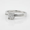 Cassims&Co. 9ct white gold engagement ring featuring a cushion-shaped diamond cluster and pavé diamond shoulders.