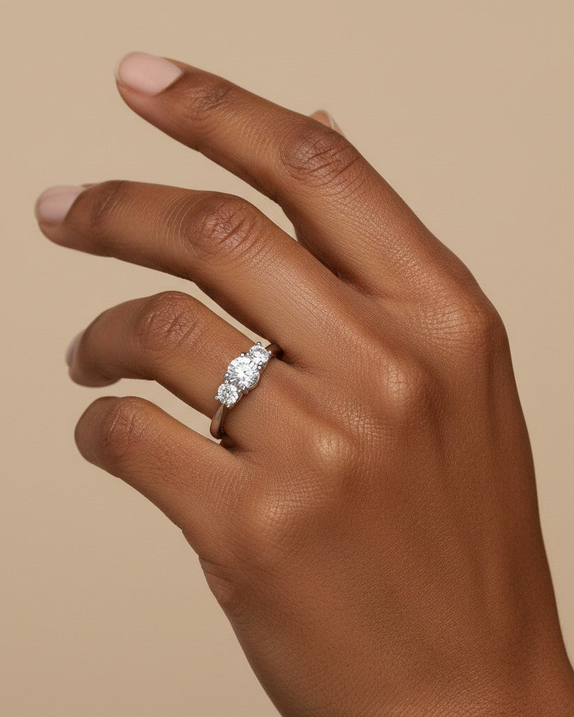 Cassims&Co. 9ct white gold three stone lab grown diamond engagement ring worn on a hand