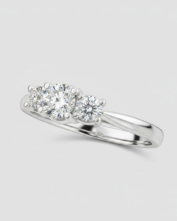 Cassims&Co. 9ct white gold three stone engagement ring featuring a 1.05ct lab grown diamond center and side stones.