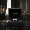 Cassims&Co. 9ct yellow gold band featuring channel-set baguette diamonds displayed in a luxury black jewellery box.