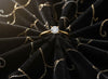 Cassims&Co. 9ct yellow gold solitaire engagement ring featuring a 0.50ct round lab grown diamond on black velvet.