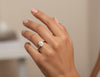 Cassims&Co. 9ct yellow gold solitaire engagement ring featuring a 1.5ct round brilliant lab grown diamond on a hand.