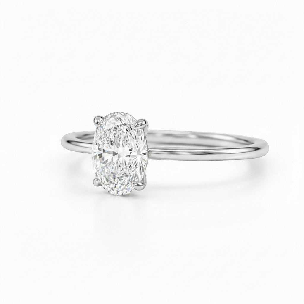 Cassims&Co. 9ct white gold engagement ring featuring a 1.5ct oval lab grown diamond in a classic four-claw setting.