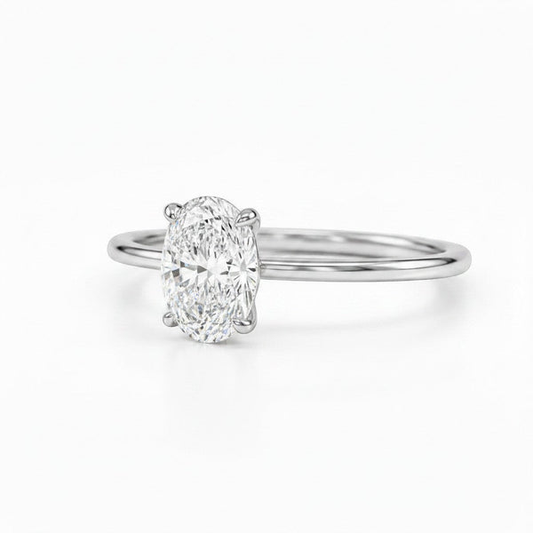 Cassims&Co. 9ct white gold engagement ring featuring a 1.5ct oval lab grown diamond in a classic four-claw setting.