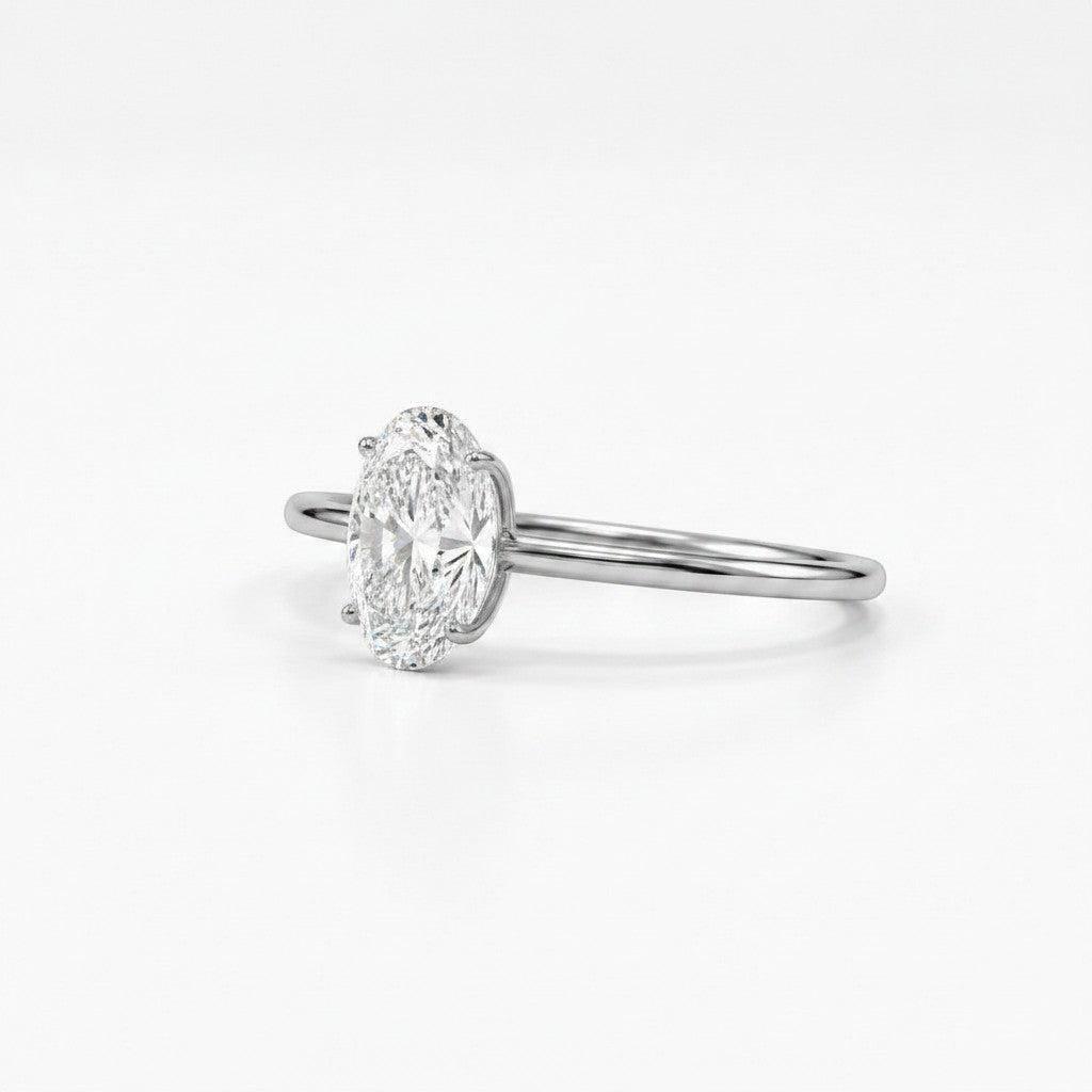 Cassims&Co. 9ct white gold engagement ring featuring a 1.00ct oval lab grown diamond in a four-prong solitaire setting.
