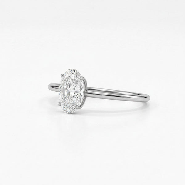 Cassims&Co. 9ct white gold engagement ring featuring a 1.00ct oval lab grown diamond in a four-prong solitaire setting.