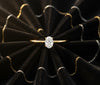 Cassims&Co. 9ct yellow gold solitaire engagement ring featuring a 0.50ct oval lab grown diamond on black velvet.
