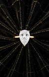 Cassims&Co. 2.00ct pear shape lab grown diamond solitaire engagement ring in 9ct yellow gold on black velvet